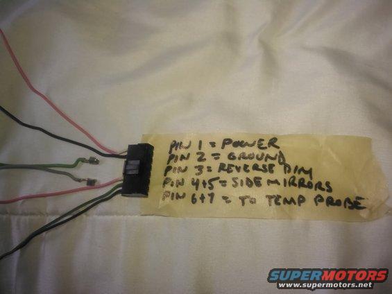 kimg0034.jpg the wiring is pretty simple. it needs a power and ground. for the tempature display it needs 2 wires ran for the sensor. optionally you can add the reverse wire but it is not needed. there are 2 wires for the side mirrors which can be removed. instead of jsut cutting them i removed the pins completely 
