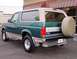 1996 Ford Bronco - This 1996 Ford Bronco is shown from the rear quarter angle, its two-tone paint and spare tire carrier.
