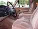 1996 Ford Bronco - Interior view of a 1996 Ford Bronco, highlighting the tan cloth seats and dashboard details.