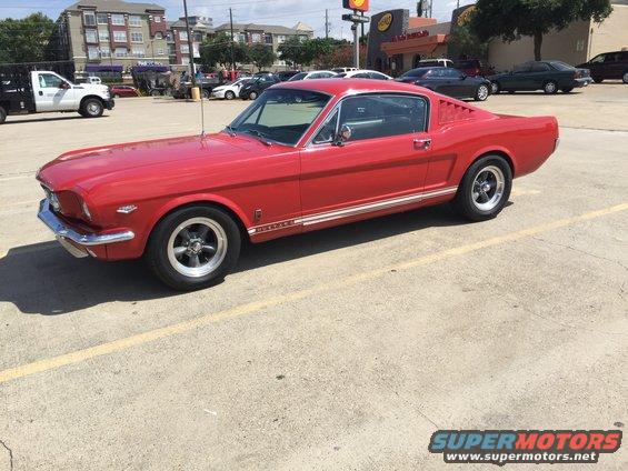 Red 1965 Ford Mustang coupe, 3q-front view