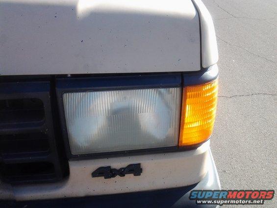 1991 Ford Bronco front corner with 4x4 badge and amber turn signal