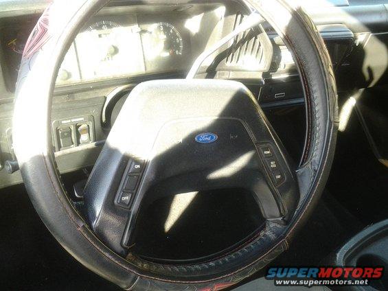 1991 Ford Bronco interior showing steering wheel, dashboard, and gauges
