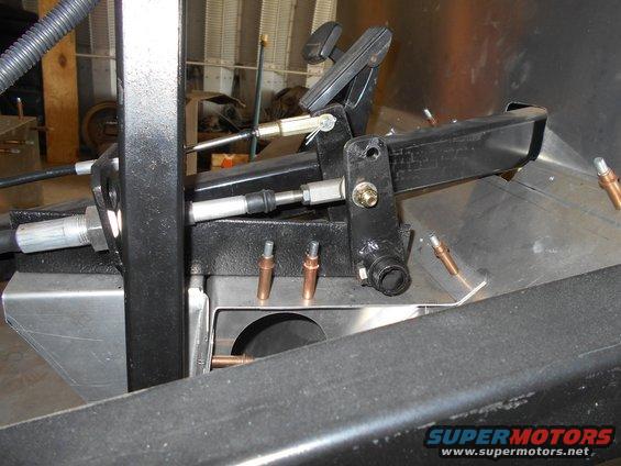 Brake pedal assembly with linkage and cables, mounted to vehicle frame