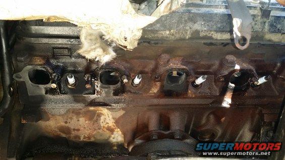 20170211_134137.jpg The hard part. I fully expected to not even get to 50% completion today. Both bolts in cylinder 4 (far left port in picture) were broken by one of the previous owners. The rear bolt in cylinder 3 was also broken but not visible with everything on. So, I only had 2 break on me, one broken stud extracted with a stud extractor. The rest will need to be drilled, no way around it. I still have the left side to do, mind you. Could only get out one stud, so off come the heads. Damn it.