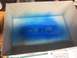 1989 Ford Bronco - Model engine parts are being spray painted blue inside a cardboard box, with instructions visible at the bottom.