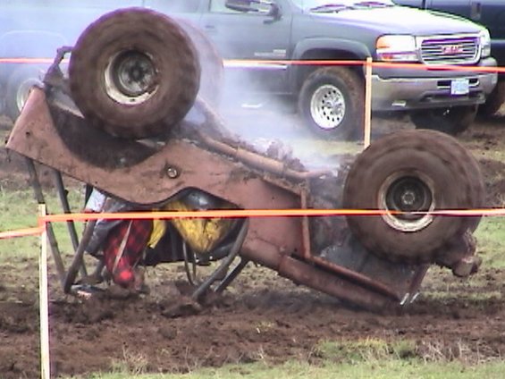 mountain-mud-fest-2004-087.jpg Jim (from 4x4 Wars) rolls his jeep, this is not the first time we've seen him do this, He's a pro!