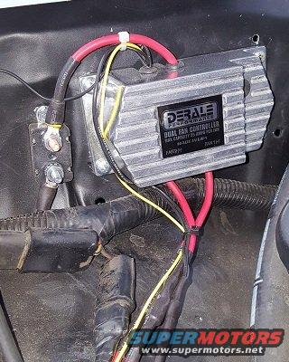 Derale Performance Dual Fan Controller mounted in engine bay with red and yellow wires