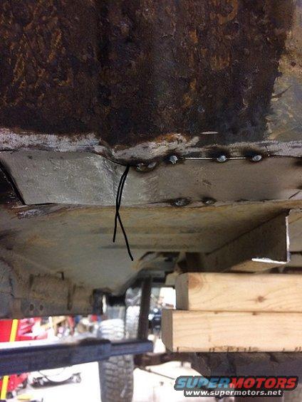 Underbody rust repair with welds and black string
