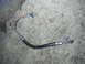 1990 Ford Bronco - This is a power steering hose, likely for a Ford vehicle, as indicated by the Supermotors.net watermark.