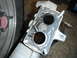1995 Ford F-150 - A close-up view of a used engine intake manifold, revealing its internal structure and condition.