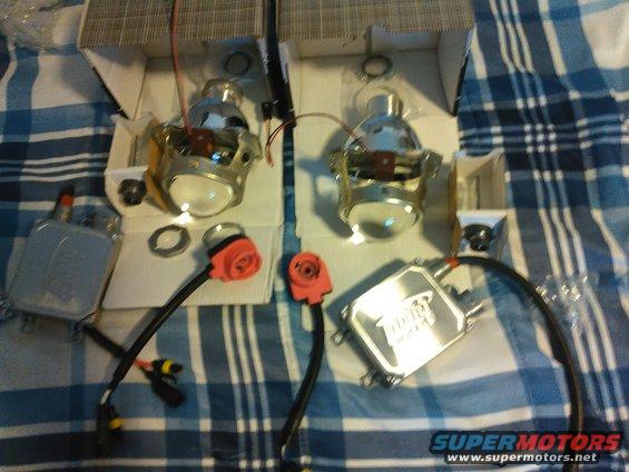 kimg0083.jpg this is the projector kit i ordered from DDM Tuning. These are D2S V2 3inch projectors. the HID kit is the Ultra 55w 5500K. The shrouds i got were E46 regular but i should probably went with the extended because there is a decent gap between it and the housing. Also these shrouds have 2 locking tabs but will not lock onto my projectors so i will have to glue them on.