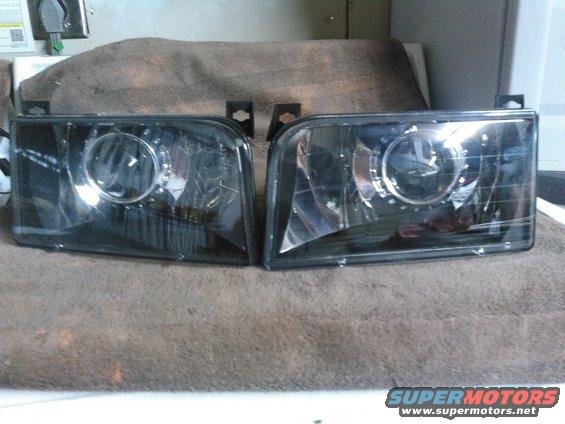 both projectors dry-fitted without glue on the lenses. i am going to clean them up better, test them out and then glue them up.

i highly recommend testing them before final install. i did and found the projector was upside down. the projector flips the light and the highbeam deflector actually needs to be on the bottom