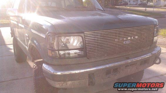 kimg0098.jpg i didn't end up taking any pics of the rest of the assembly but it was very easy and assembled like it should.

the projector i glued with JB weld to the metal piece on the headlight assembly i mentioned earlier to help support when offroading. the shroud i also glued in place. 

for the lenses i cleaned the old glue out best i could and used ARBO Windscreen Tape  which was avalible at DDM Tuning but i could probably of reused the original glue if i needed to. 

i went ahead and installed the headlights along with new marker lights, turn signals and headlight doors. 

this is how it came out. the black looked much better than the chrome the truck originally had. the grille needs to be painted black and the truck was still muddy from offroading the previous weekend. 