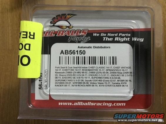 Motorcycle fork seal and dust kit in plastic packaging with yellow sticker