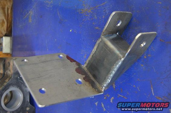 Made this bracket to help stiffen the dropped track bar mount. it uses the existing bolts for shock mount and the engine perch.