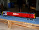 1969 Lincoln Continental - Model train with large numbers on its side sits on a blue surface.