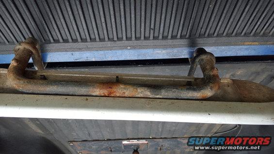 rusted running board bracket attached to vehicle frame