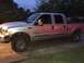 2004 Ford F-150 - This silver 2004 Ford F-150 pickup truck is shown from a 3q-front angle.