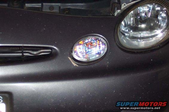 1996 Ford Taurus front bumper with headlight and fog light