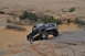 1991 Ford Bronco - Black 1992 Ford Bronco navigating a rocky off-road course in a desert landscape.