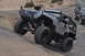 1991 Ford Bronco - A modified Jeep Wrangler navigates a rocky incline, with another vehicle visible in the background.