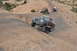 1991 Ford Bronco - A lifted 1992 Ford F-150 navigates a steep, rocky trail in Moab, Utah, with other off-road vehicles following behind it tow.