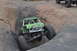 1991 Ford Bronco - This custom off-road buggy is tackling a challenging rock climb, demonstrating its extreme suspension and tire capabilities.