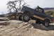 1991 Ford Bronco - This lifted Ford Bronco navigates a rocky desert terrain, its off-road capabilities.