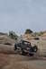 1991 Ford Bronco - This 1991 Ford Bronco is navigating a challenging off-road course in a desert landscape.