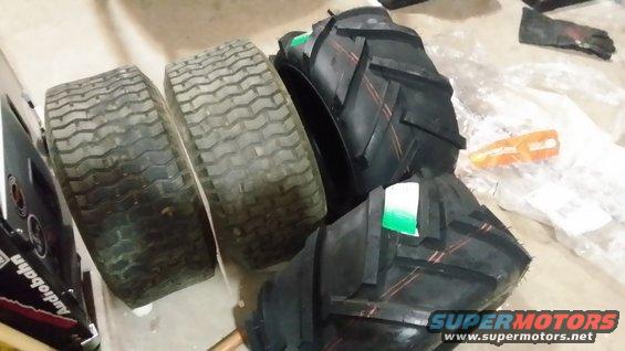 Two used lawnmower tires and two new tractor tires