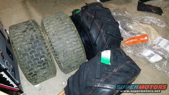 Two used lawn tractor tires and two new tractor tires with tags