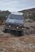 1991 Ford Bronco - This Ford Bronco navigates a challenging rocky trail, its front grille indicating a 1992 model year.