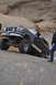 1991 Ford Bronco - A black 1991 Ford Bronco navigates a steep, rocky incline during an off-road excursion.