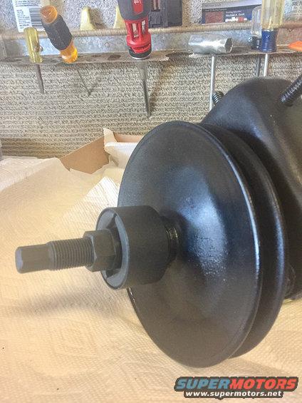 Black power steering pump pulley with threaded shaft and nut