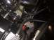 1982 Ford Bronco - Close-up view of engine components including the power steering pump and various hoses.