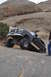 1991 Ford Bronco - This 1991 Ford Bronco is navigating a challenging off-road trail with steep rock formations.