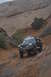 1991 Ford Bronco - This 1991 Ford Bronco navigates a challenging off-road path in a desert landscape.