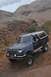 1991 Ford Bronco - This 1991 Ford Bronco navigates a challenging off-road course with its distinctive two-tone paint and lifted stance.