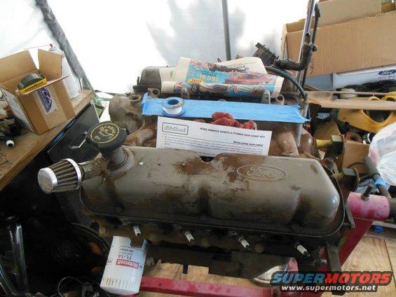 Ford V8 engine on stand with Edelbrock instructions and oil filter