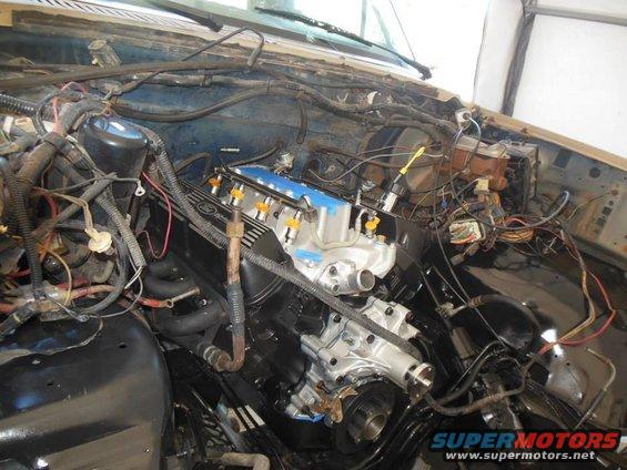 Engine bay with new engine, fuel injectors, and wiring