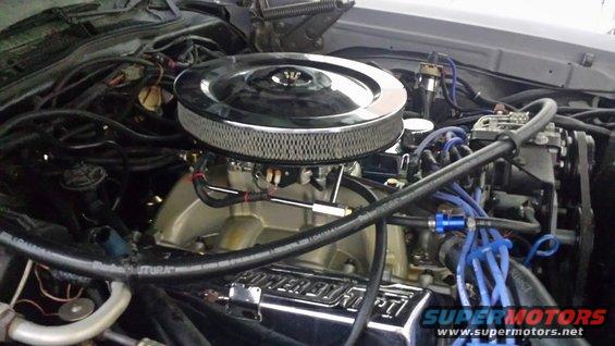 Engine intake with chrome air cleaner and blue spark plug wires