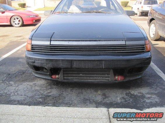 1988 Toyota Celica front view with pop-up headlights and aftermarket intercooler