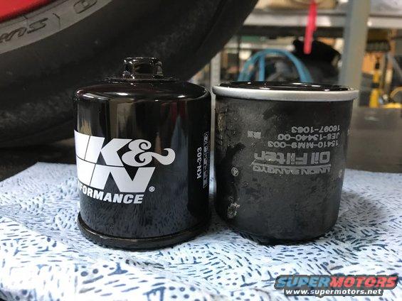 K&N oil filter next to a used oil filter