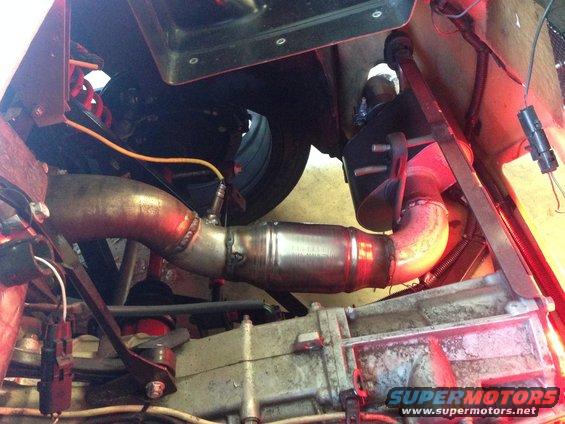 Exhaust pipe and catalytic converter with transmission visible below