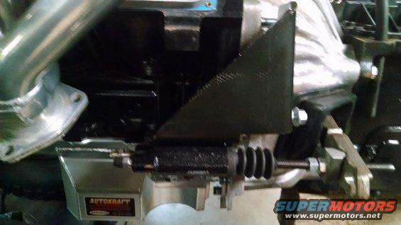 Close-up of engine component with 'AUTOKRAFT' label and 'SUPERMOTORS' watermark