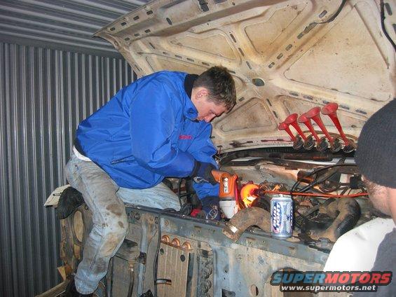 img_0327.jpg Priming the engine with the biggest drill Home Depot had since nothing else I had or borrowed had enough juice to pump oil through my engine. Also Im out of old jackets and since its 30 degrees outside and that little stupid electric heater sucks Im using my nice work jacket...