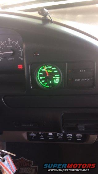 Dashboard with green air pressure gauge showing 18 psi, speedometer, and 4x4/low range indicators