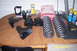 1995 Ford Bronco - Various vehicle suspension components are arranged on a wooden table, ready for installation.