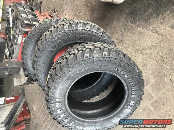 Several Mud Beast MT tires stacked, one in front showing 35x12.50R20LT size