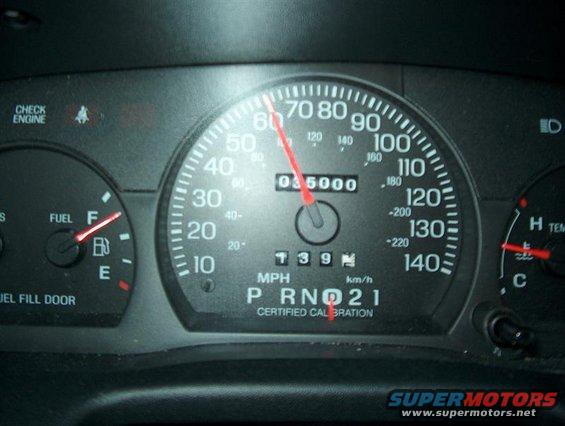 Speedometer reads 60 mph, odometer shows 035000 miles. Fuel gauge is near full. Check engine light is on